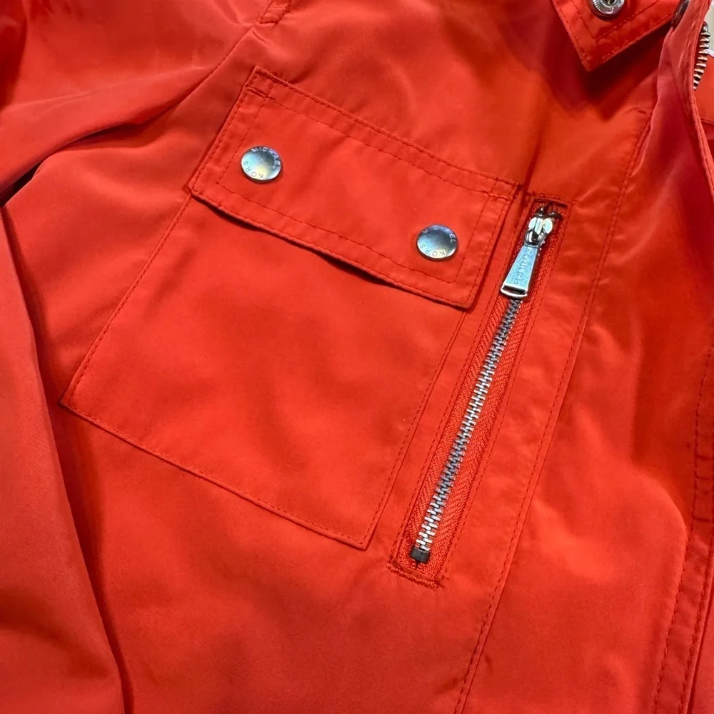 NWOT Michael Kor’s Women's Orange Hooded Rain Coat Jacket with silver details